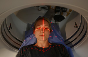 technologist with a patient having a CT Scan