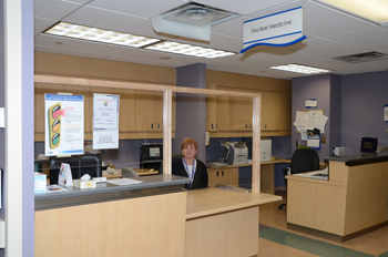 clerk at nuclear medicine reception desk
