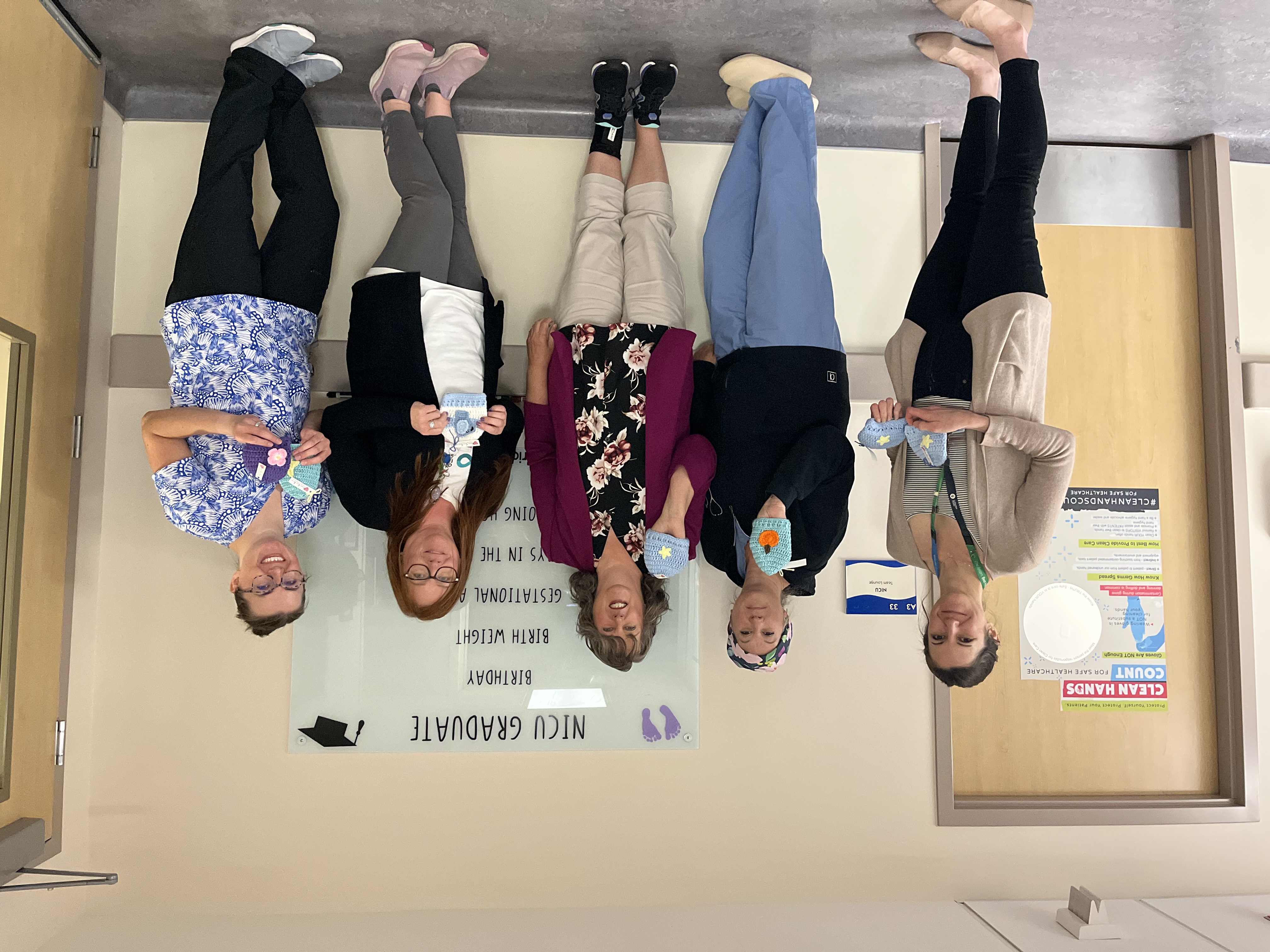 Photo of team members with donated crocheted hats